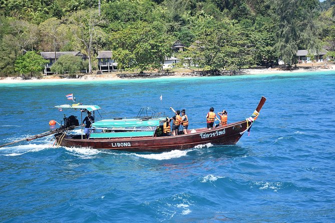 4 Island Tour to Emerald Cave by Longtail Boat from Koh Lanta - Getting on the boat: pickup, pier meeting, and timing
