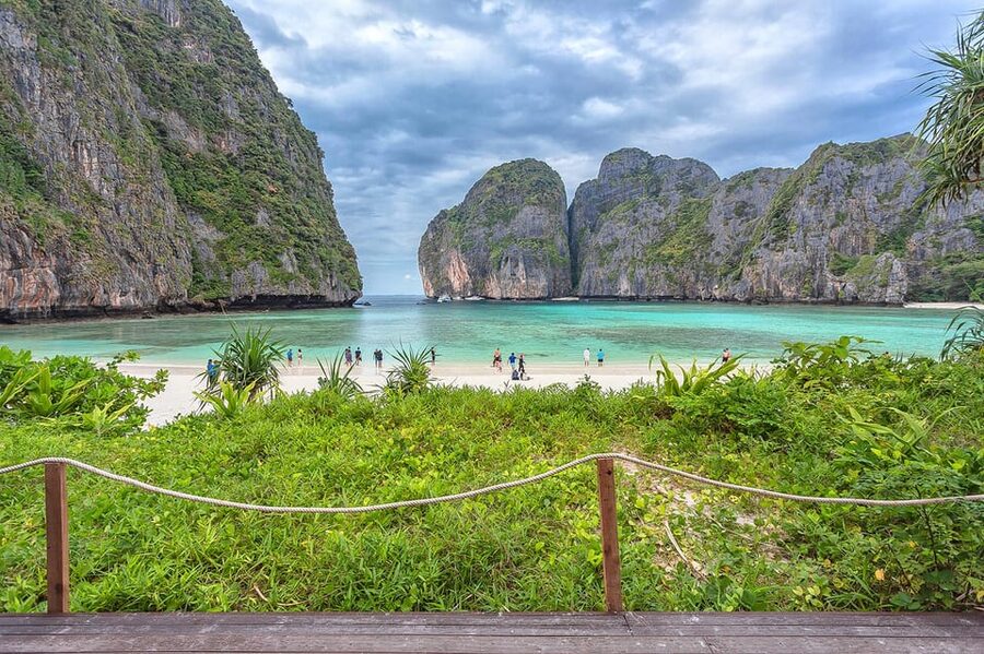 From Krabi: Maya Bay, Bamboo & Phi Phi Islands Day Tour - Phileh Lagoon snorkelling: cliffs, clear water, and fish on the surface