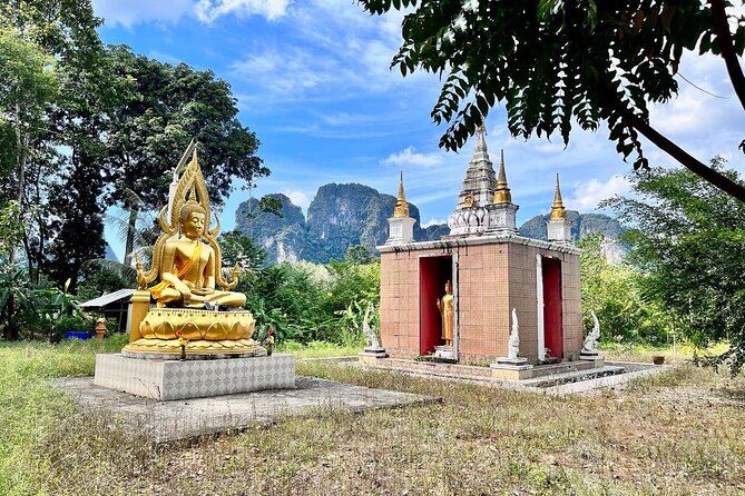 Guided Mountain Biking - Grand Tour - Trails of Ao Nang - The forest monastery stop under a rock arch