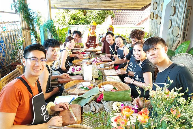 Home Style Family class with fruit carving and market tour - Cooking in an open-air kitchen with Teacher Bee