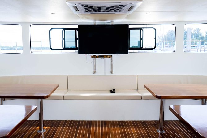 Luxury Sunset Cruise at Krabi's Coastlin with Power Catamaran - Poda Island: palm-and-pine scenery with beach access